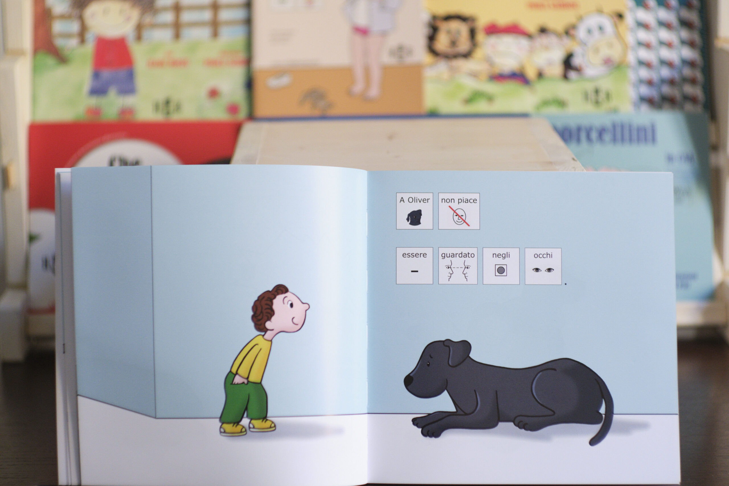 pagina di libro in simboli che rappresenta un bambino e un cane